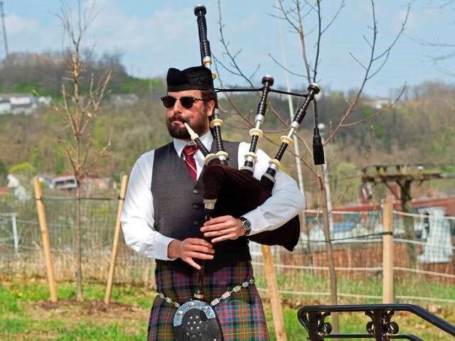 evan burlew playing bagpipes